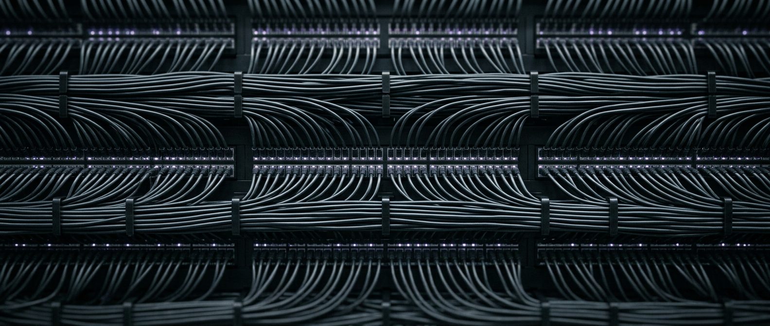 Structured network cabling running across a patch panel